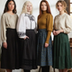 Autumn outfits featuring moss green and sage skirts, green corduroy midi skirts, cream knitwear and chestnut ankle boots.